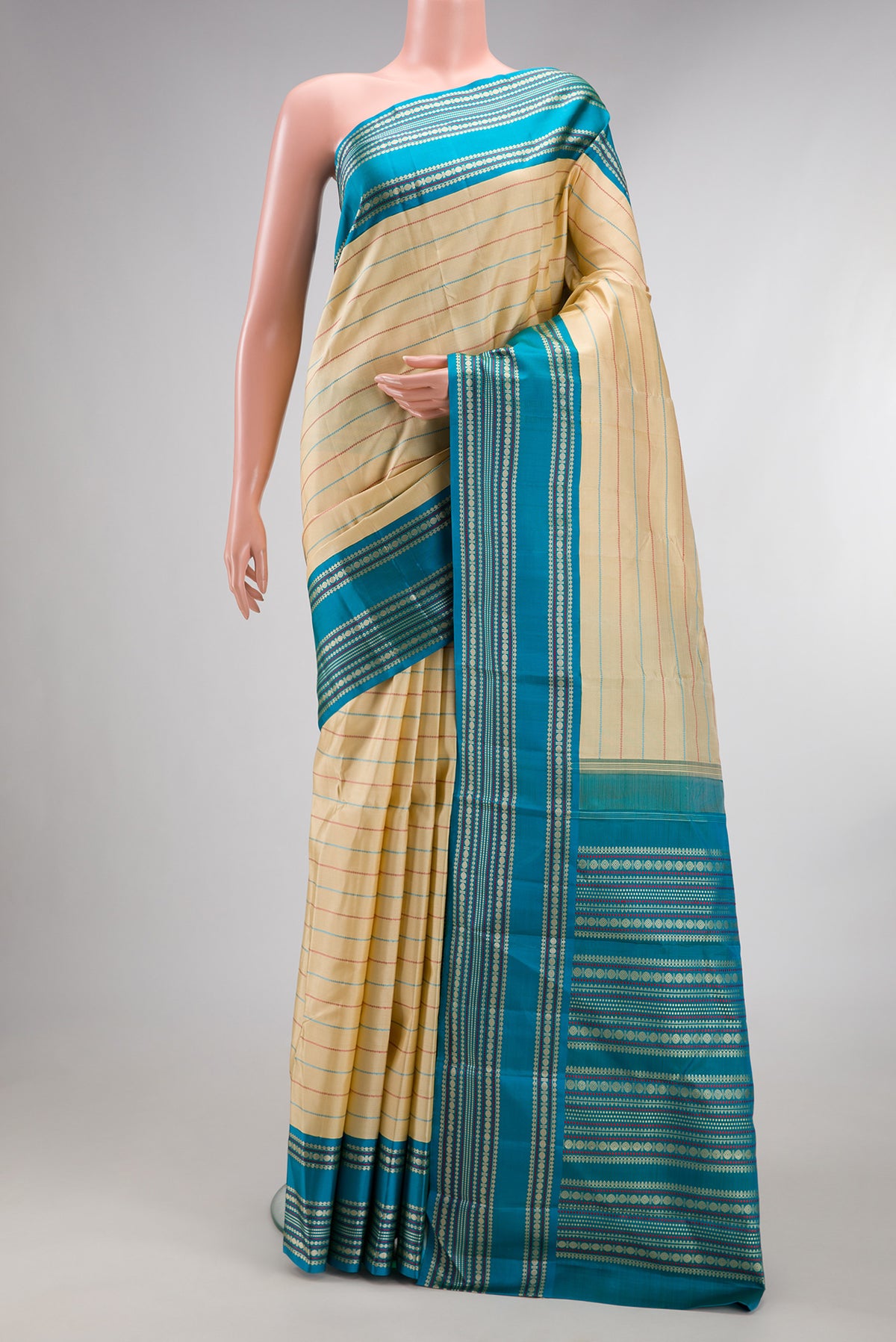Pure Silk Sandal Kanchipuram Saree with Veldhari on the body and Thread Border.  displayed on a mannequin