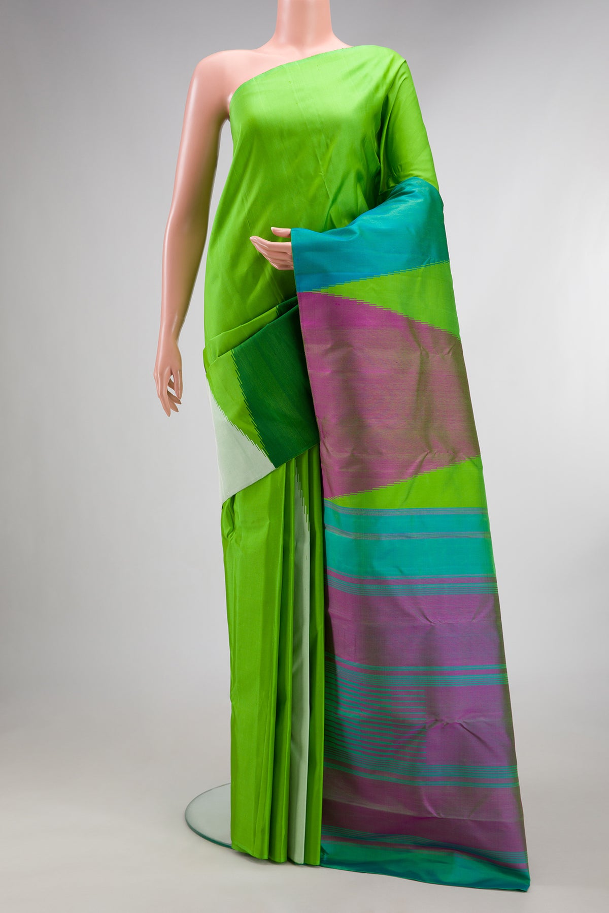 Pure Silk Parrot Green Dual Tone Kanjivaram Saree with Plain Body and Temple Border.  displayed on a mannequin