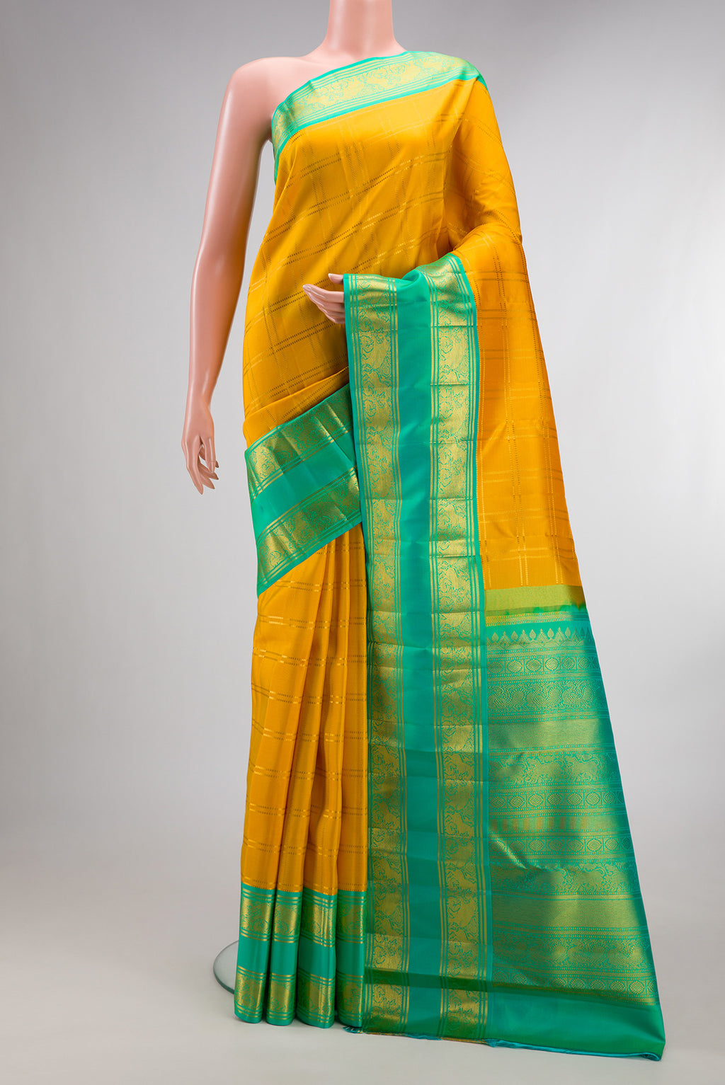 Pure Silk Yellow Kanjivaram Saree with Checked design on the body and Zari Border.  displayed on a mannequin