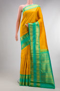 Pure Silk Yellow Kanjivaram Saree with Checked design on the body and Zari Border.  displayed on a mannequin