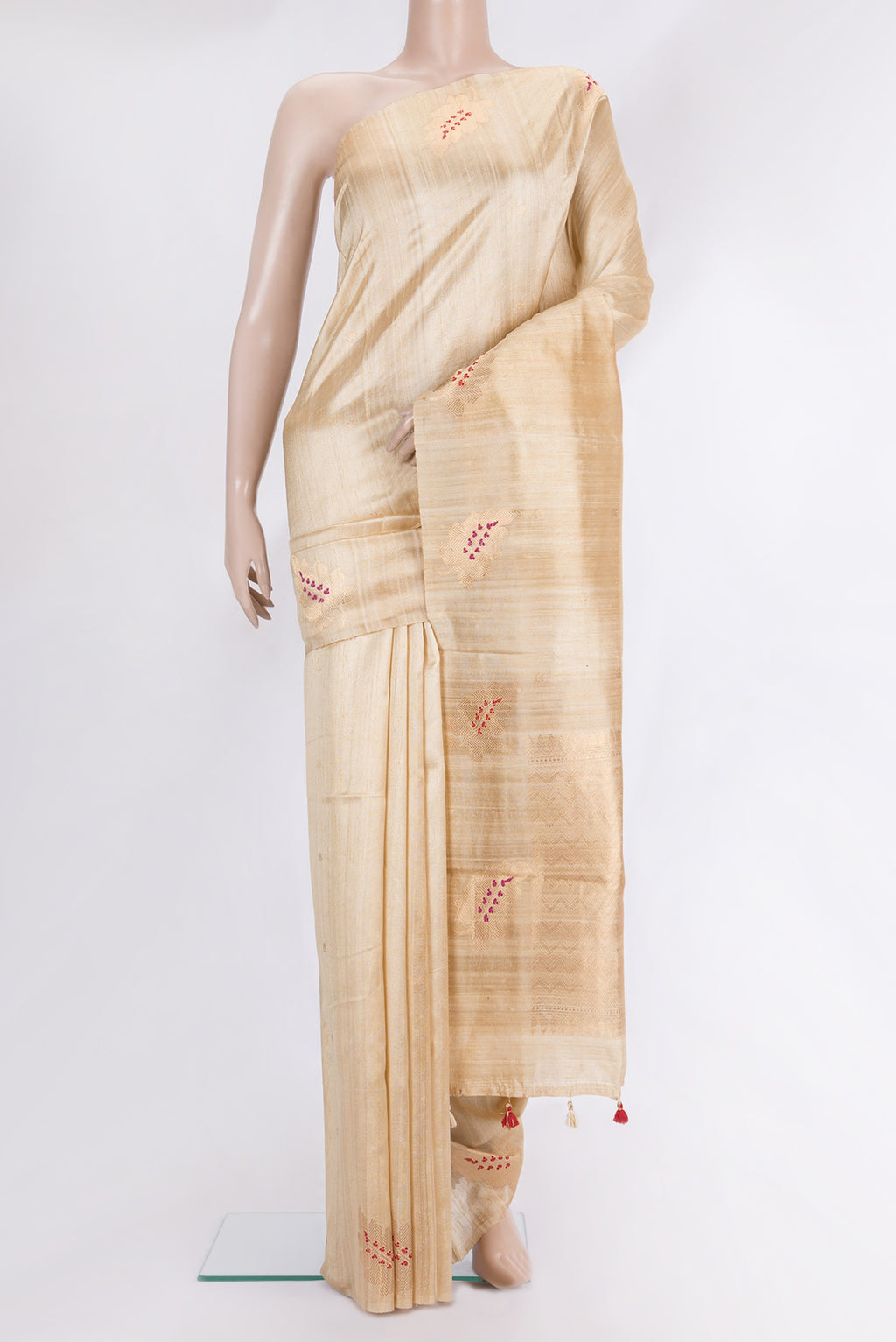 Pure Silk Sandal Banarasi Tussar Saree with Zari Butta on the body and Without Border.  displayed on a mannequin