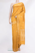 Pure Silk Mustard Banarasi Katan Saree with Zari Butta on the body and Fancy Border.  displayed on a mannequin