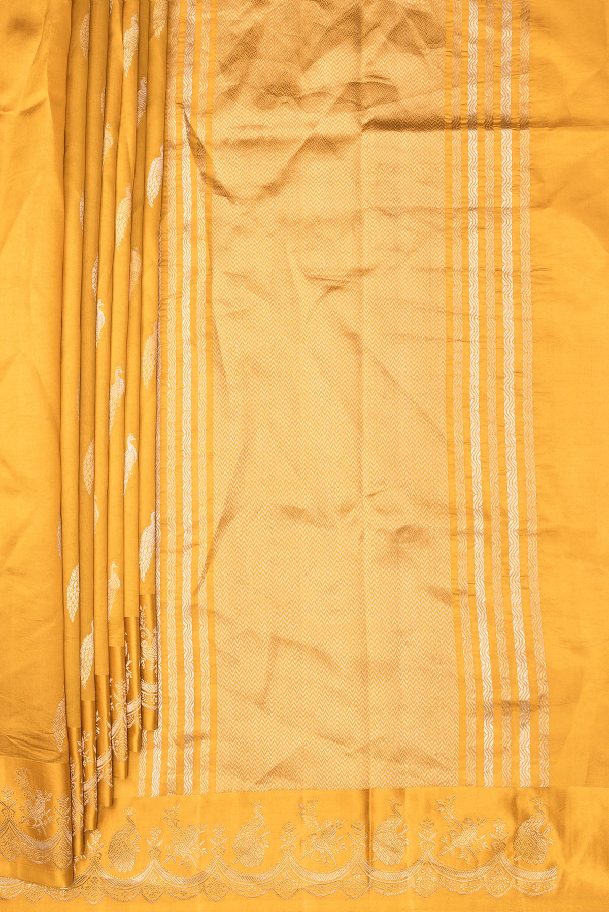 Pleats and pallu of Pure Silk Mustard Banarasi Katan Saree with Zari Butta on the body and Fancy Border. 