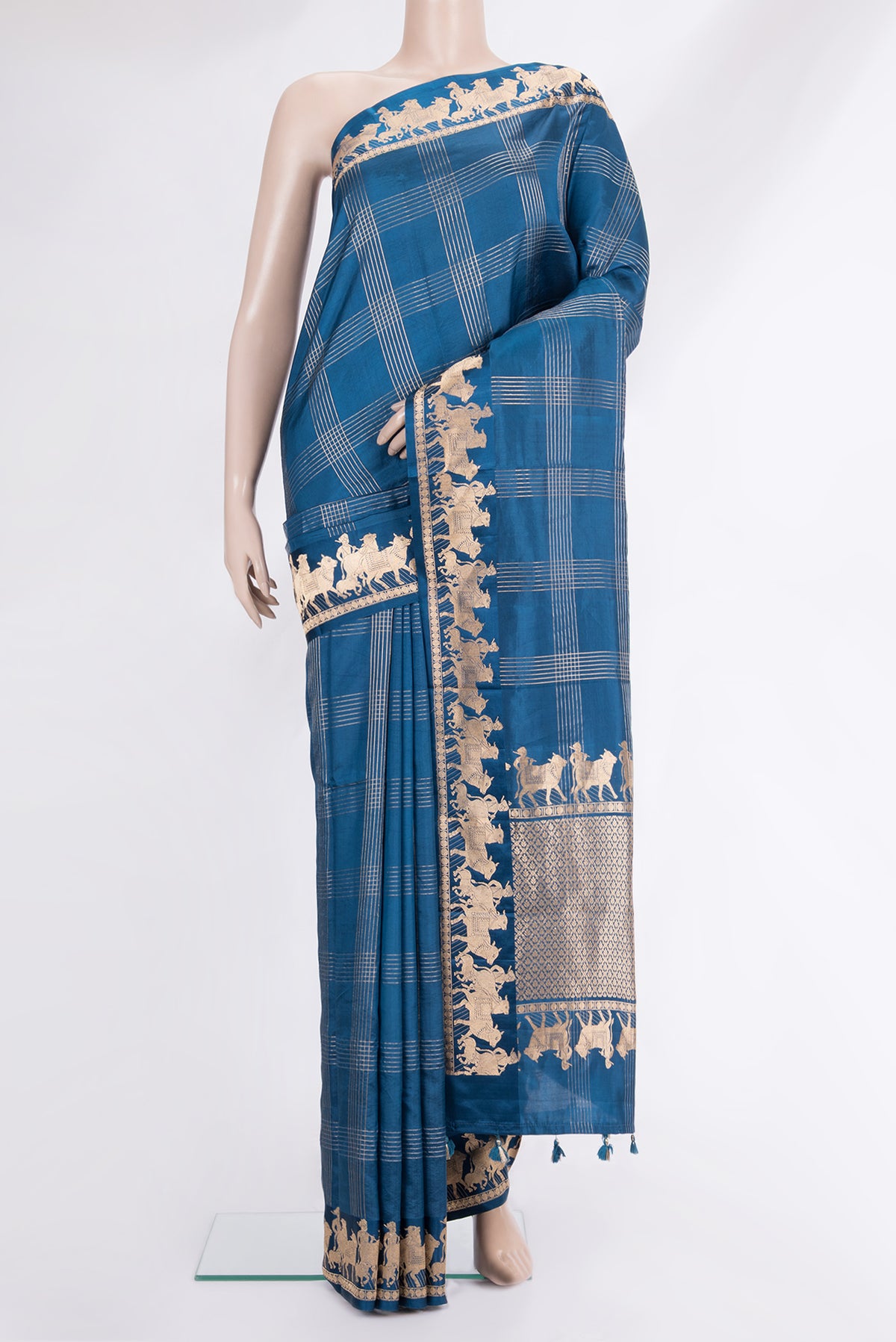 Pure Silk Peacock Blue Banarasi Saree with Checked design on the body and Fancy Border.  displayed on a mannequin
