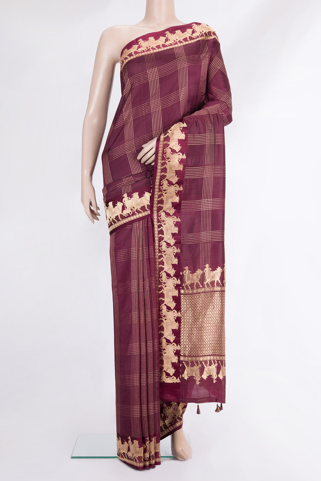 Maroon Tussar Saree with Checked design on the body and Fancy Border.  displayed on a mannequin