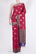 Red Raw Saree with Zari Butta on the body and Zari Border.  displayed on a mannequin