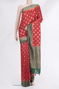 Red Raw Saree with Zari Butta on the body and Zari Border.  displayed on a mannequin