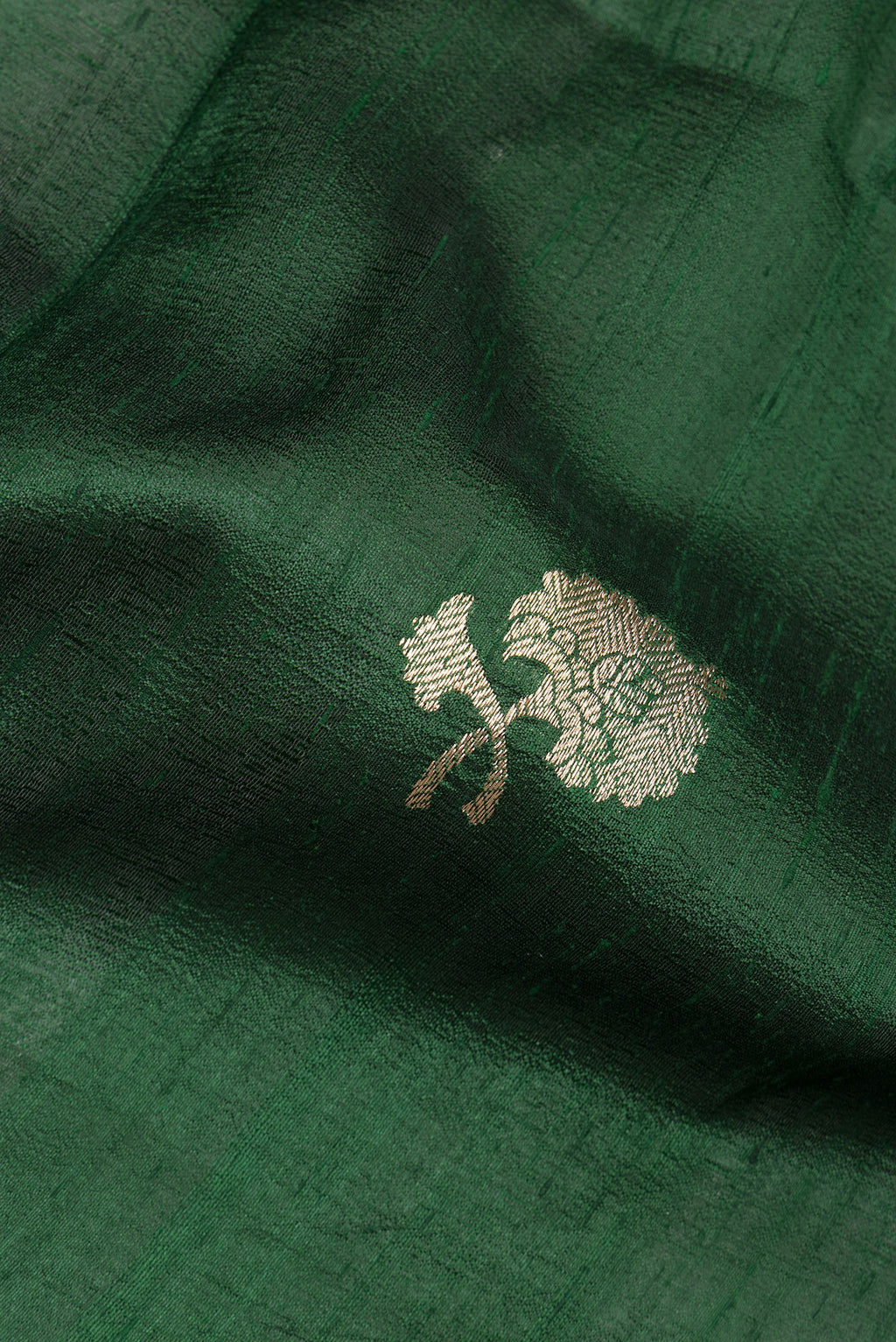 Close up of Pure Silk Bottle Green Banarasi Tussar Saree with Zari Butta on the body and Zari Border.  displaying folds