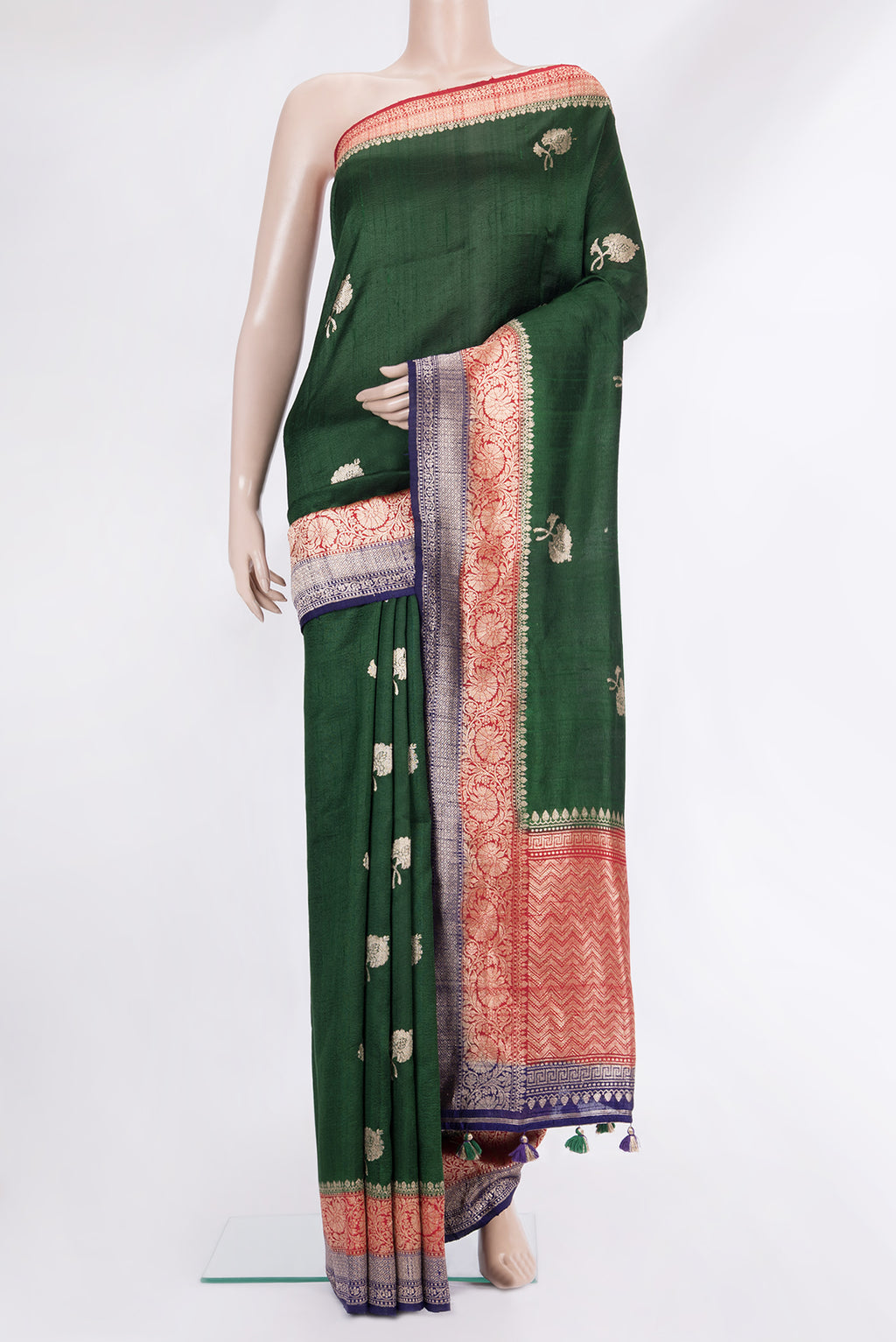 Pure Silk Bottle Green Banarasi Tussar Saree with Zari Butta on the body and Zari Border.  displayed on a mannequin