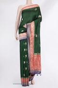 Pure Silk Bottle Green Banarasi Tussar Saree with Zari Butta on the body and Zari Border.  displayed on a mannequin