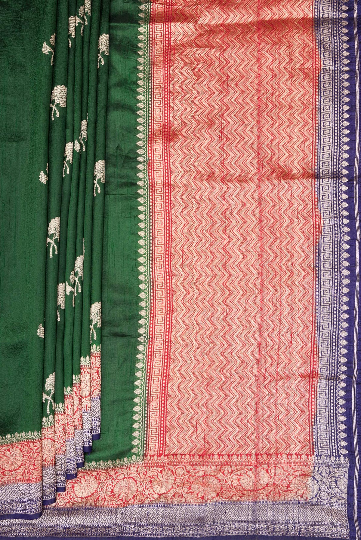 Pleats and pallu of Pure Silk Bottle Green Banarasi Tussar Saree with Zari Butta on the body and Zari Border. 