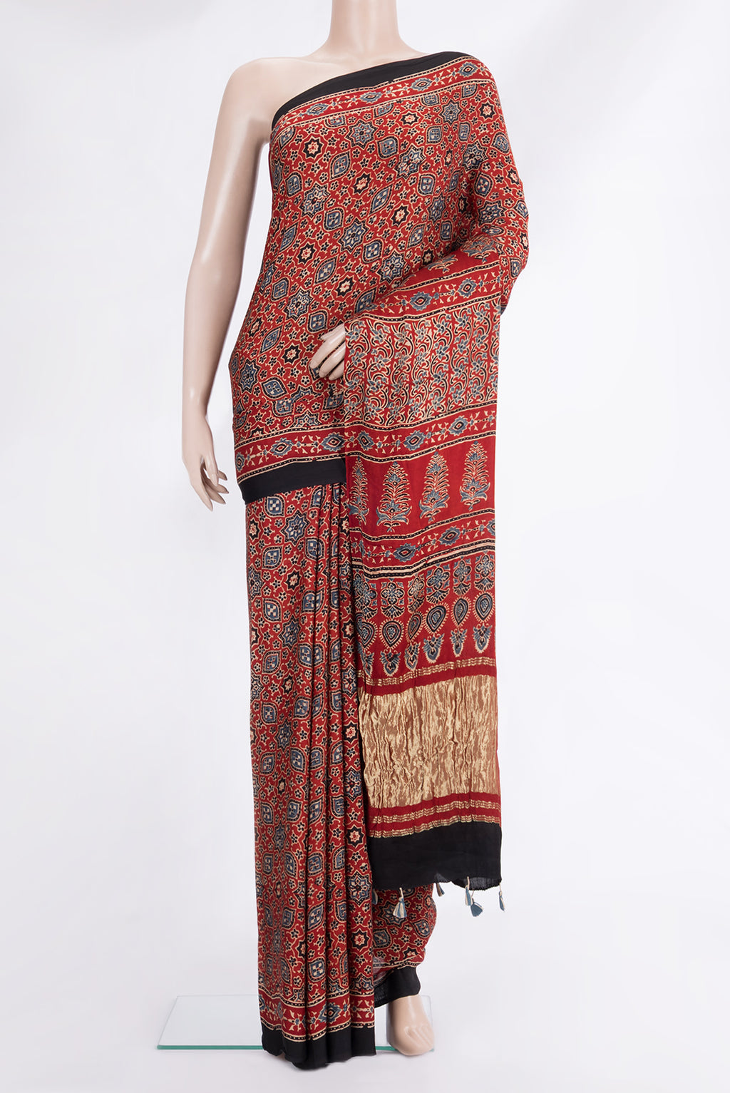 Rust Blended Satin Silk Saree with Ajrakh Print on the body and Printed Border.  displayed on a mannequin