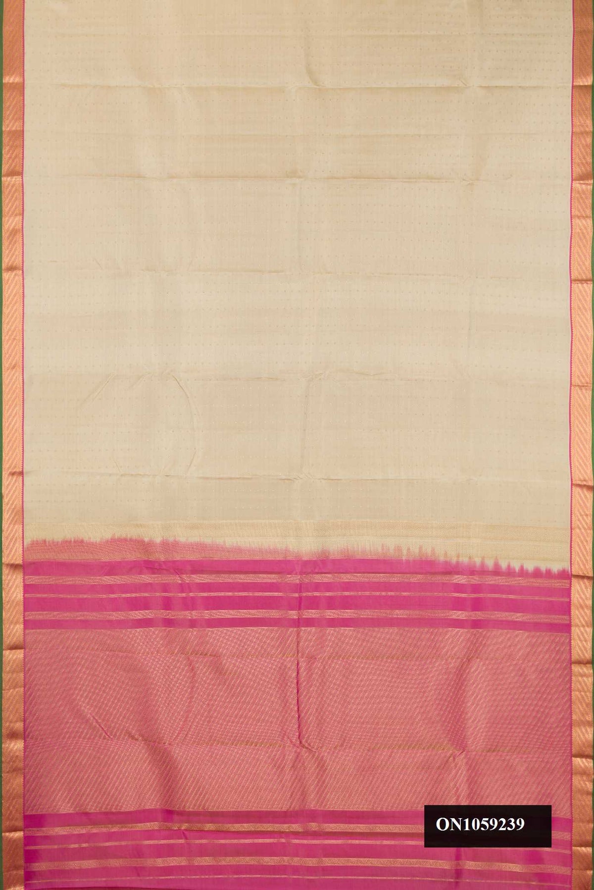 Beige Dual Tone Kanchipuram Silk Saree with Zari Butta on the body and Zari Border.  displayed on a mannequin