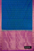 Peacock Blue Dual Tone Kanchipuram Silk Saree with Zari Butta on the body and Zari Border.  displayed on a mannequin