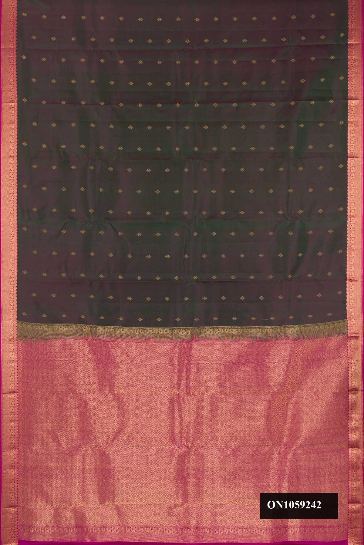 Bottle Green Dual Tone Kanchipuram Silk Saree with Zari Butta on the body and Zari Border.  displayed on a mannequin