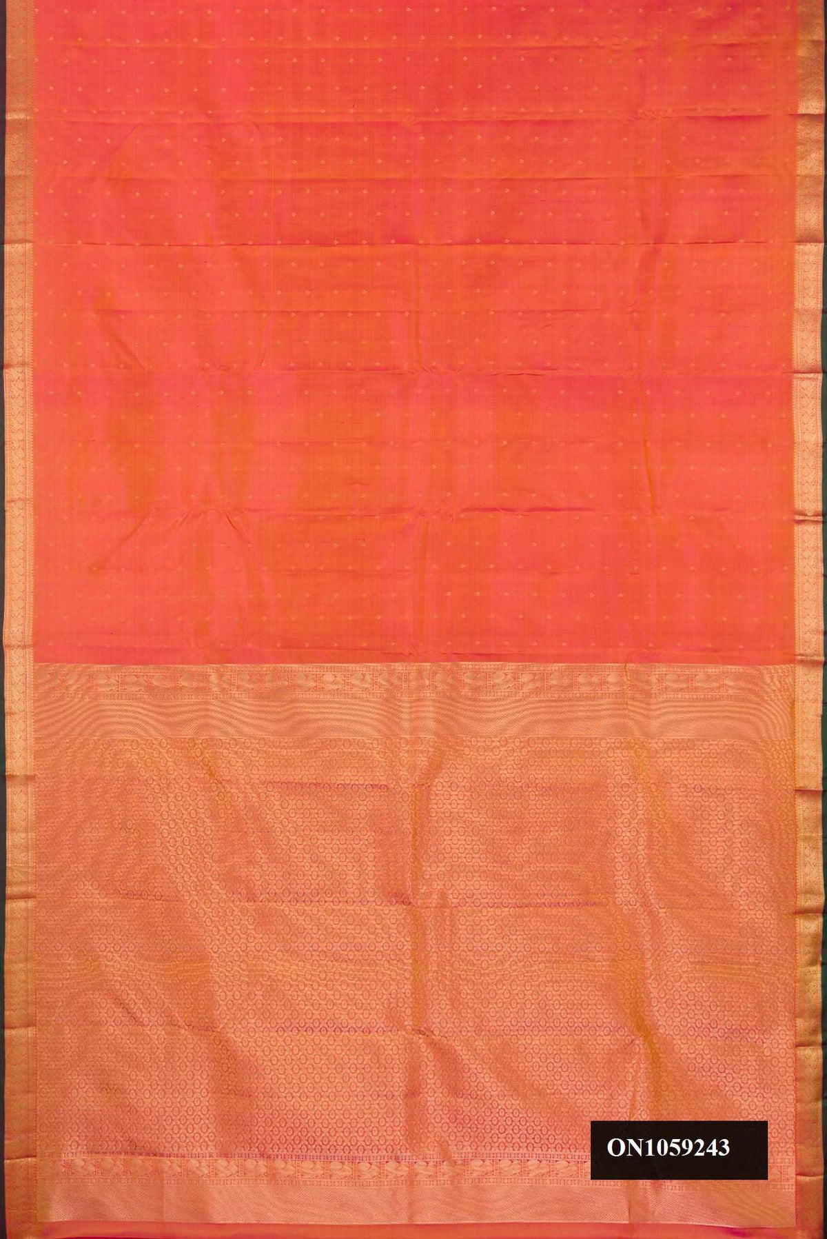 Coral Dual Tone Kanchipuram Silk Saree with Zari Butta on the body and Zari Border.  displayed on a mannequin