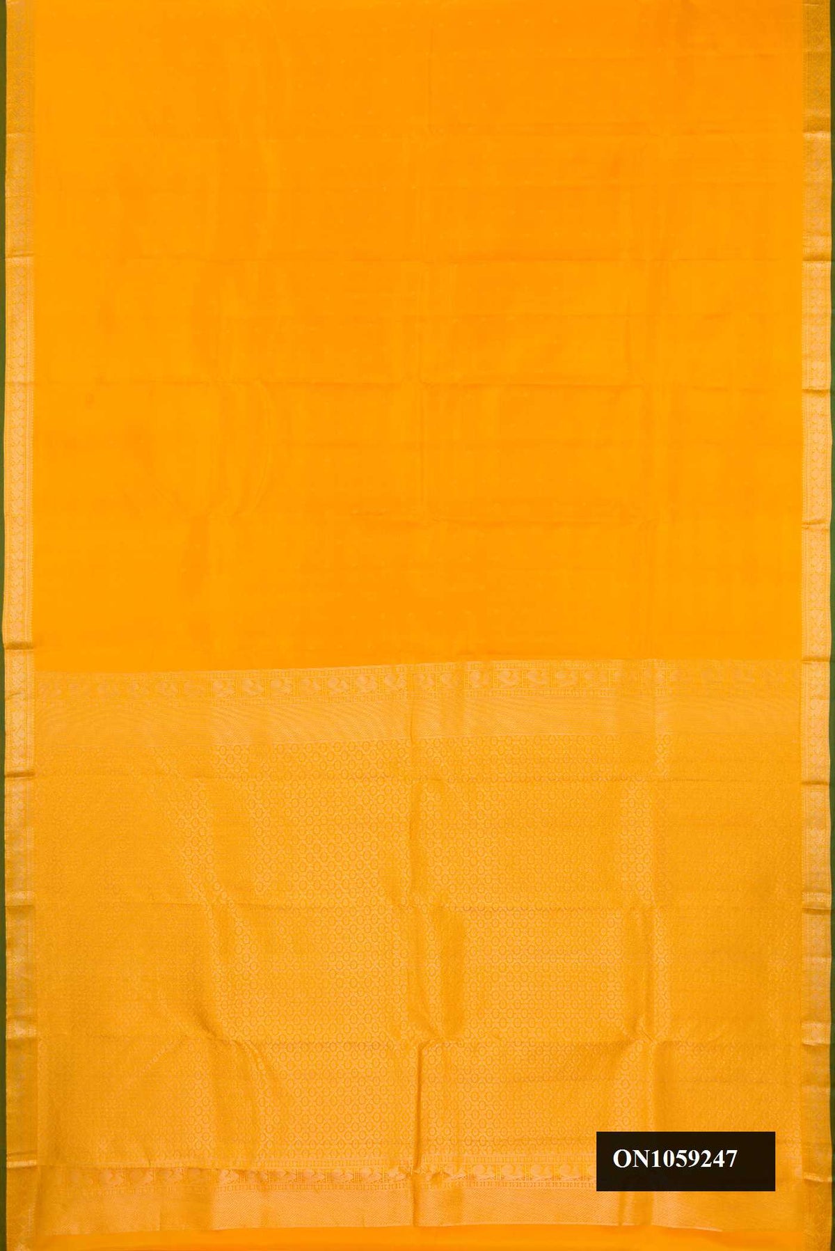 Mustard Dual Tone Kanchipuram Silk Saree with Zari Butta on the body and Zari Border.  displayed on a mannequin