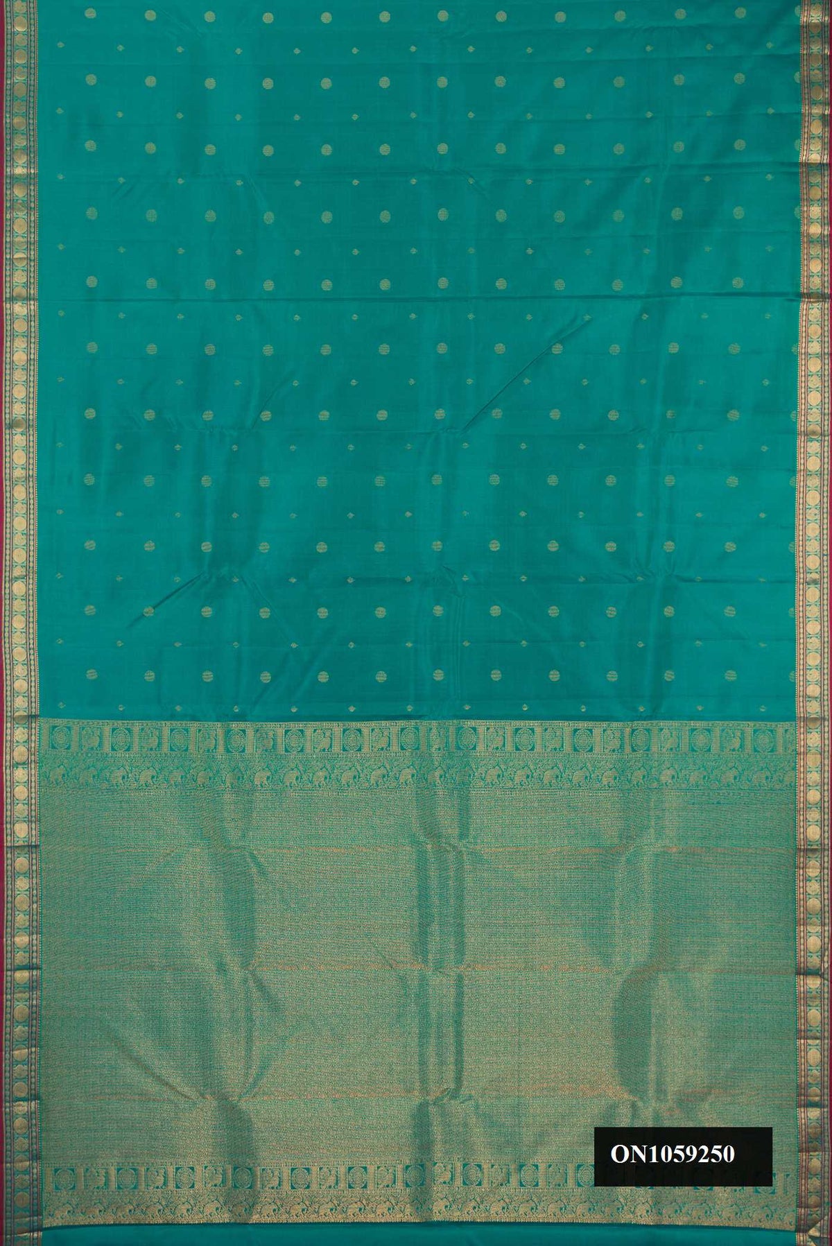 Green Dual Tone Kanchipuram Silk Saree with Zari Butta on the body and Zari Border.  displayed on a mannequin