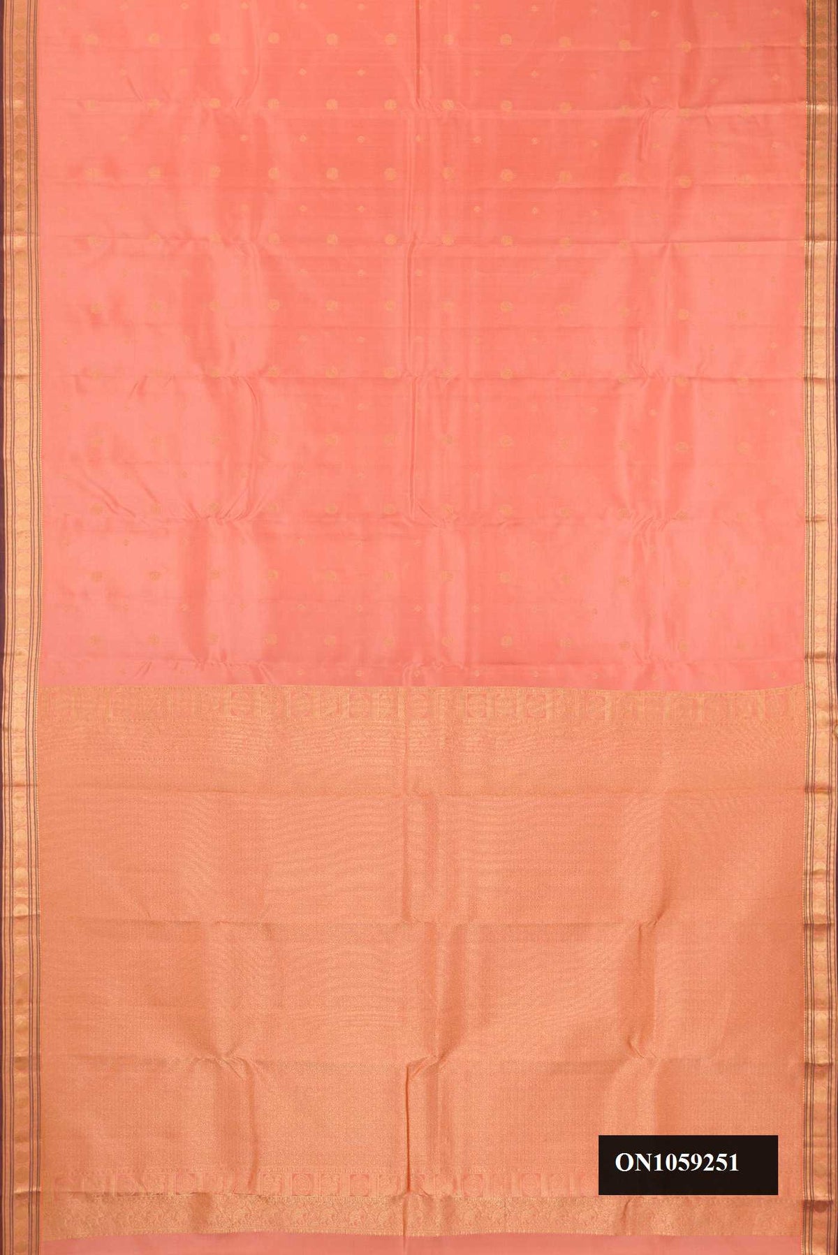 Peach Dual Tone Kanchipuram Silk Saree with Zari Butta on the body and Zari Border.  displayed on a mannequin