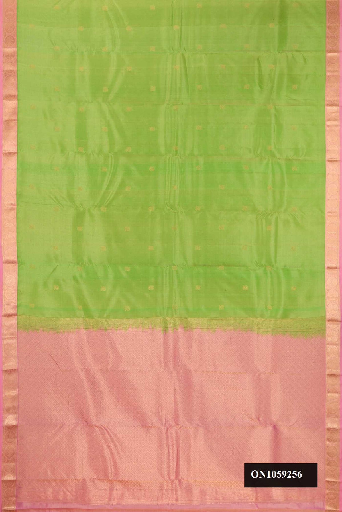 Parrot Green Dual Tone Kanchipuram Silk Saree with Zari Butta on the body and Zari Border.  displayed on a mannequin