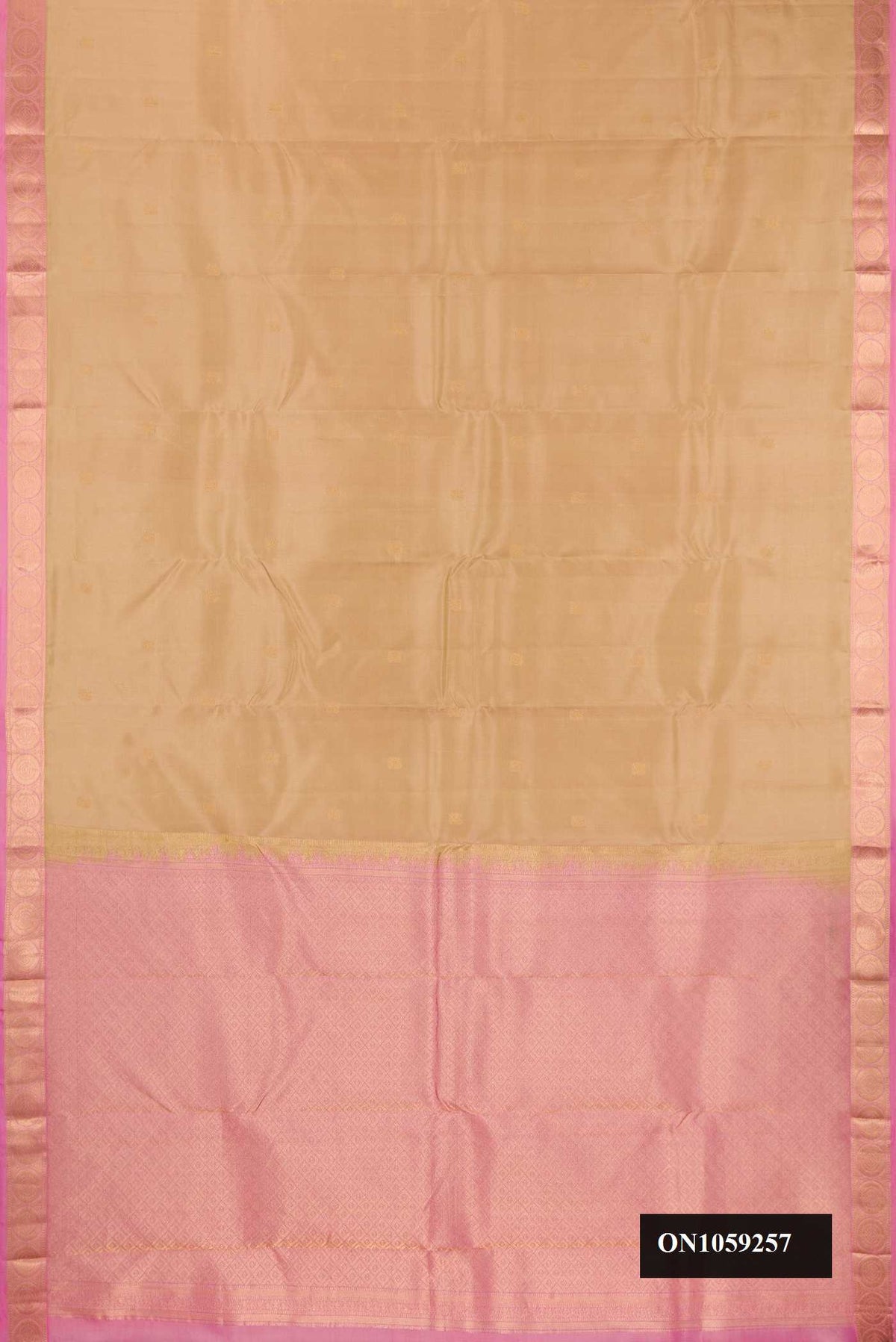 Dark Beige Dual Tone Kanchipuram Silk Saree with Zari Butta on the body and Zari Border.  displayed on a mannequin