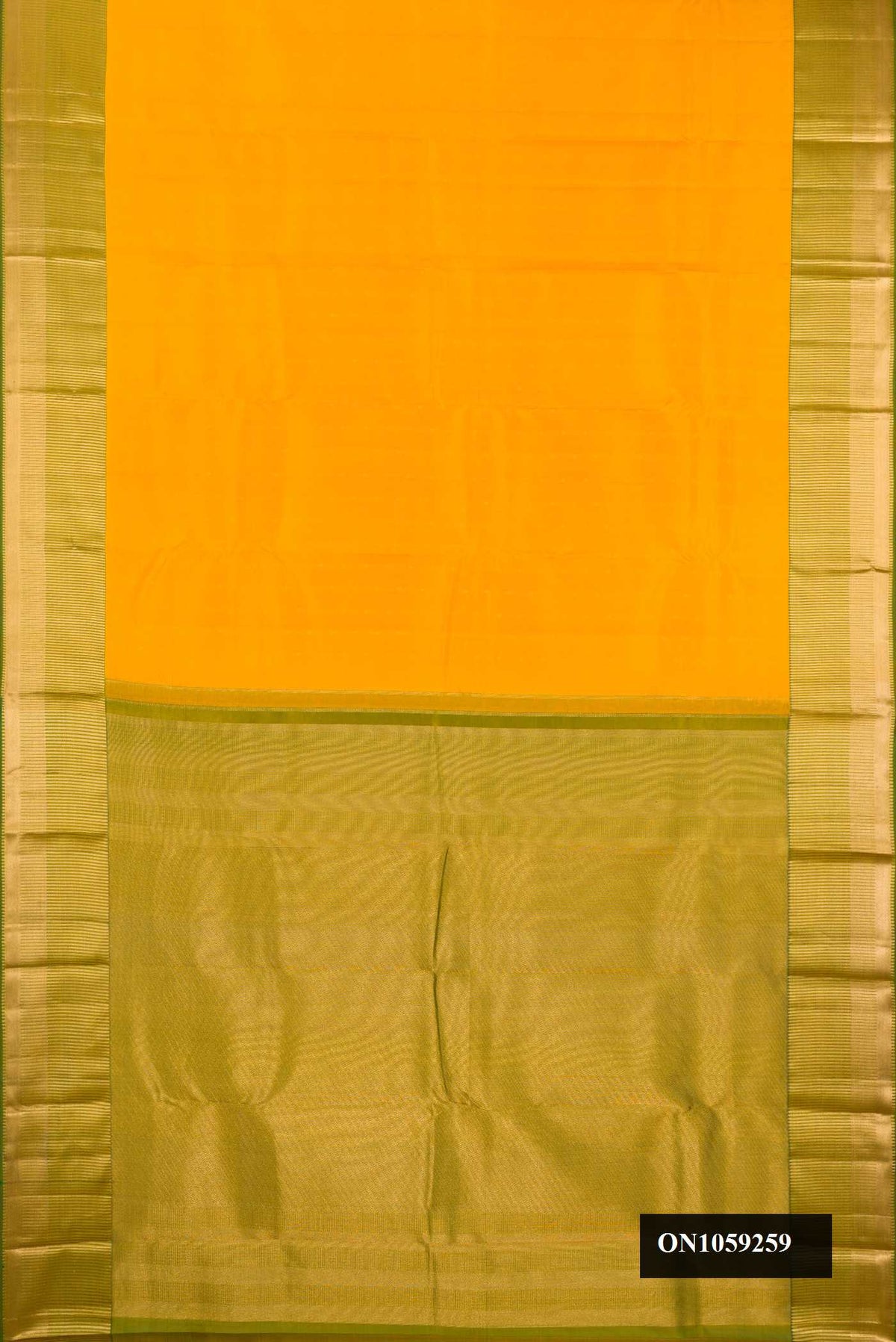Yellow Dual Tone Kanchipuram Silk Saree with Zari Butta on the body and Zari Border.  displayed on a mannequin