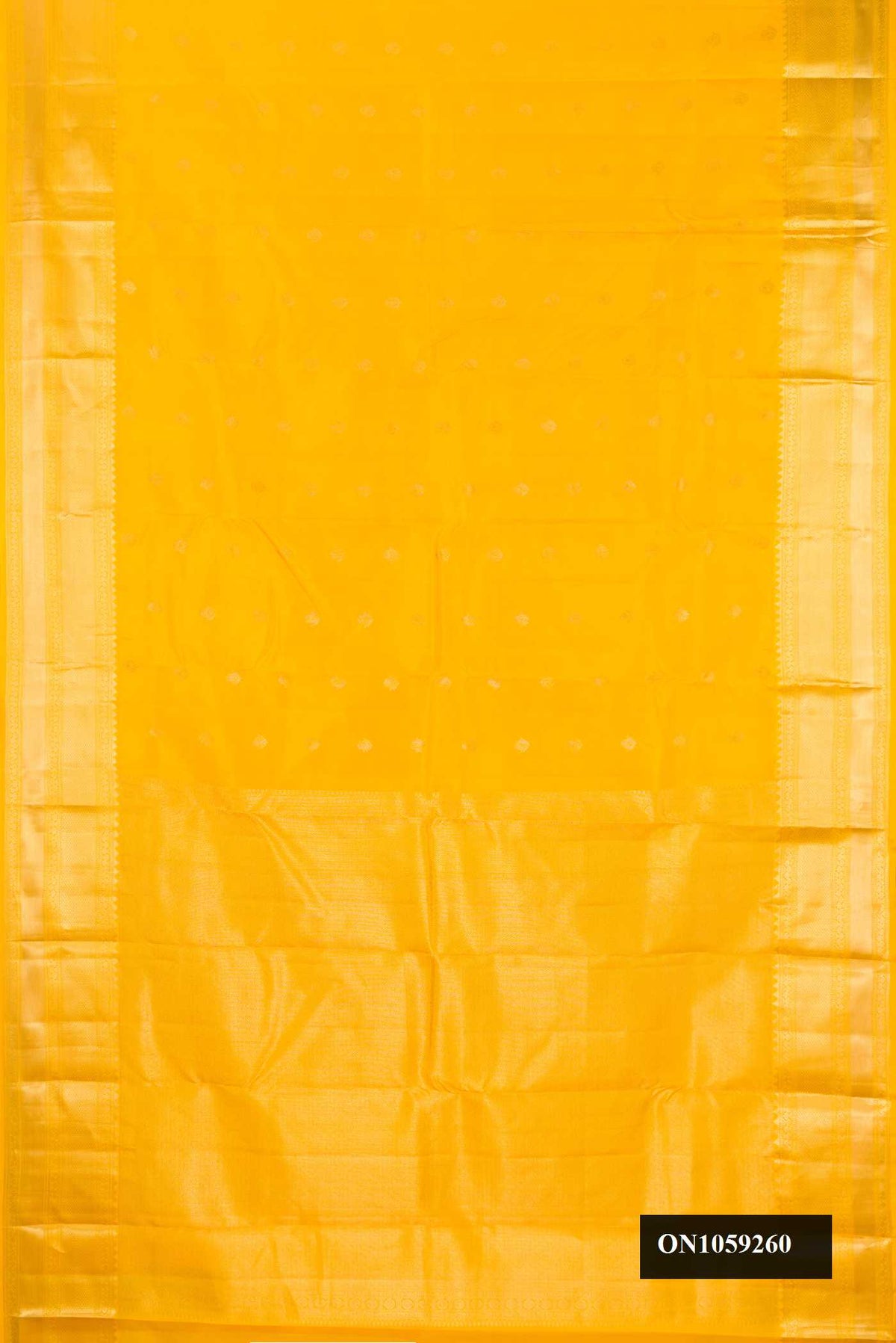 Yellow Dual Tone Kanchipuram Silk Saree with Zari Butta on the body and Zari Border.  displayed on a mannequin