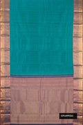 Green Dual Tone Kanchipuram Silk Saree with Zari Butta on the body and Zari Border.  displayed on a mannequin