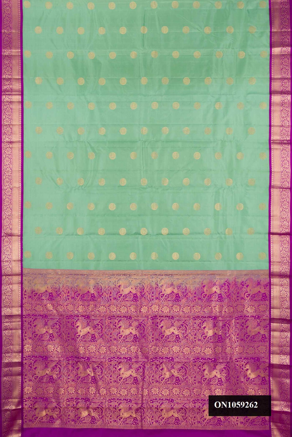 Pista Green Dual Tone Kanchipuram Silk Saree with Zari Butta on the body and Zari Border.  displayed on a mannequin