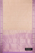 Beige Dual Tone Kanchipuram Silk Saree with Zari Butta on the body and Zari Border.  displayed on a mannequin