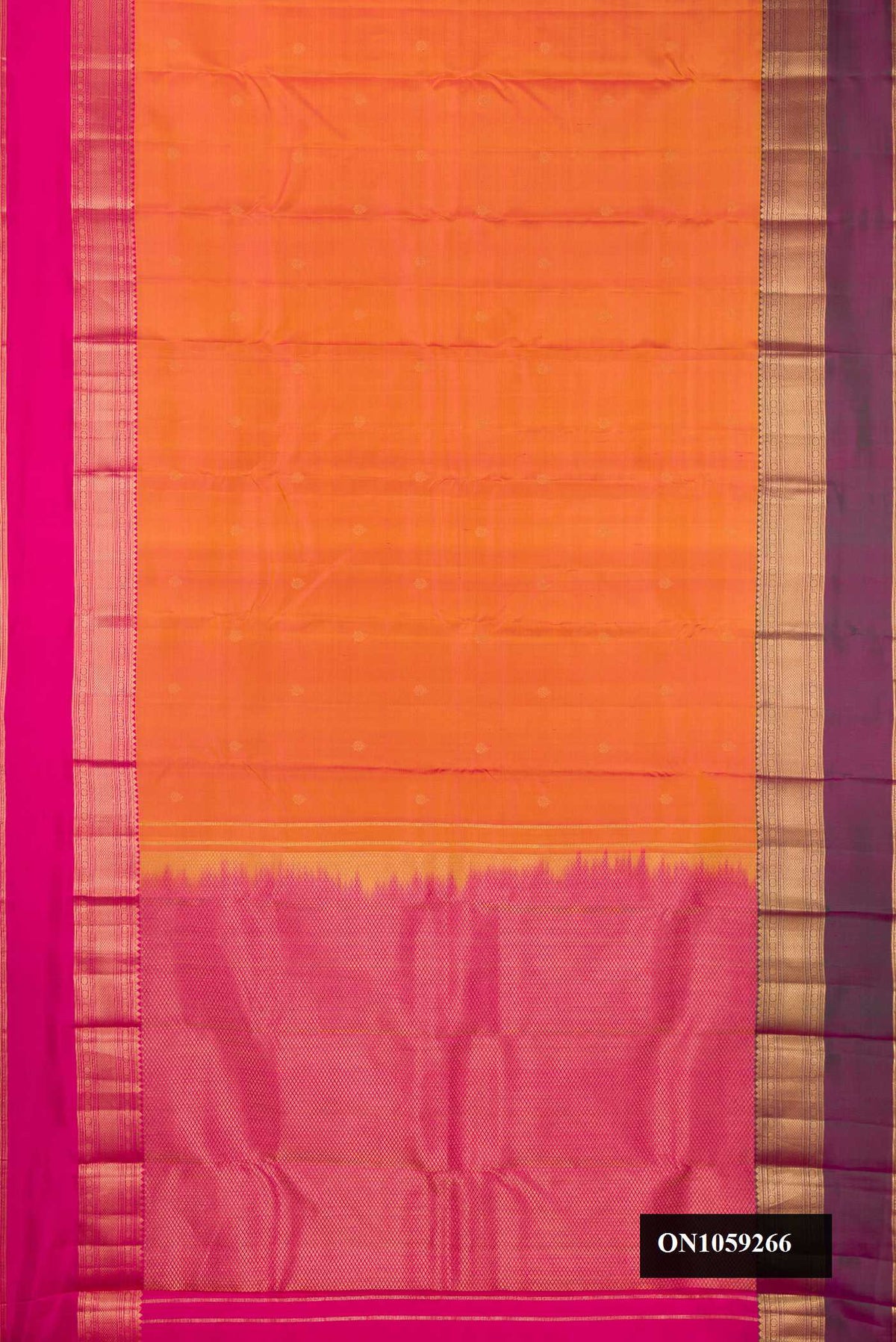Coral Dual Tone Kanchipuram Silk Saree with Zari Butta on the body and Ganga Jamuna Border.  displayed on a mannequin