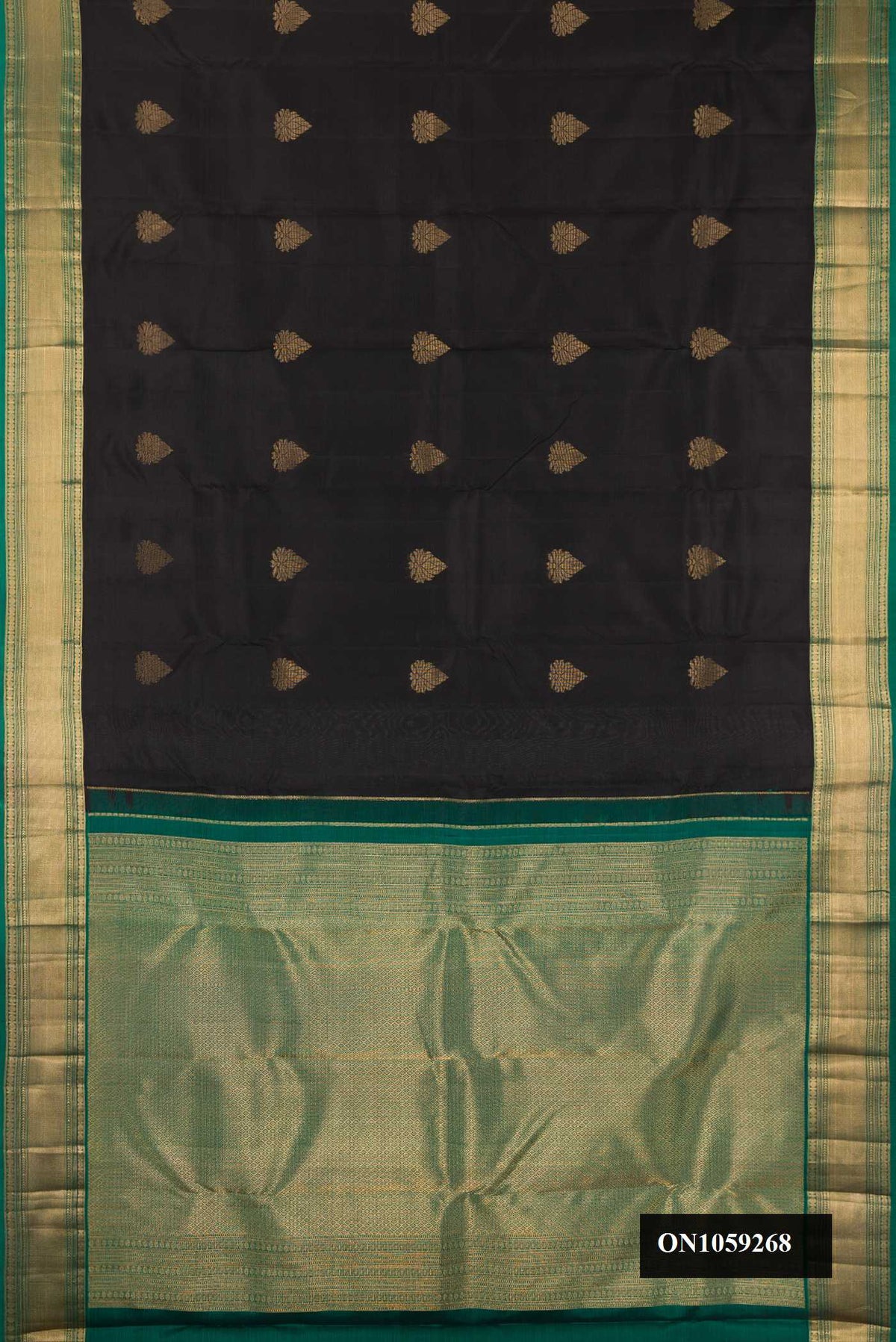 Black Dual Tone Kanchipuram Silk Saree with Zari Butta on the body and Zari Border.  displayed on a mannequin