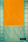 Mustard Dual Tone Kanchipuram Silk Saree with Zari Butta on the body and Zari Border.  displayed on a mannequin
