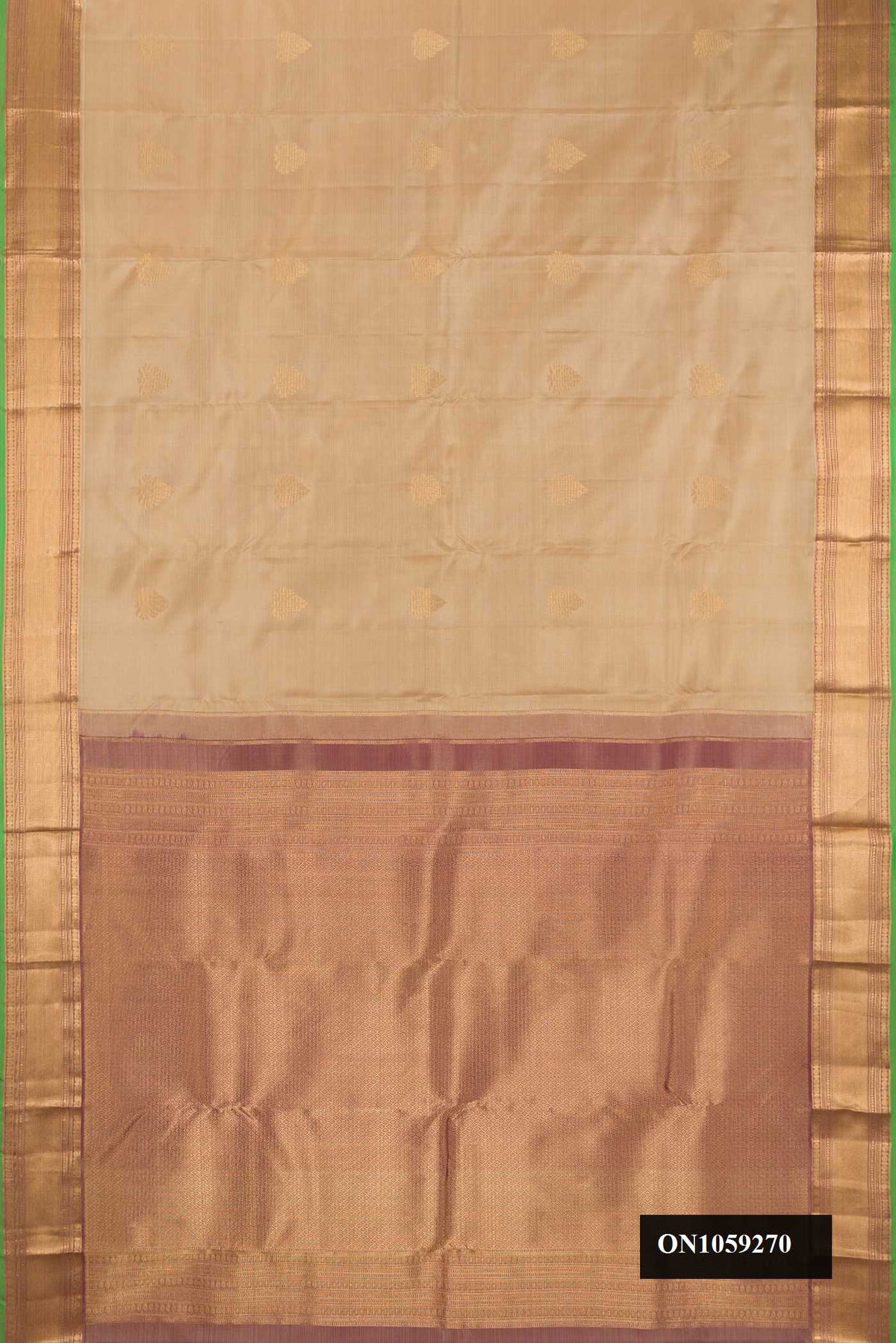 Dark Beige Dual Tone Kanchipuram Silk Saree with Zari Butta on the body and Zari Border.  displayed on a mannequin