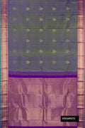 Mehandi Green Dual Tone Kanchipuram Silk Saree with Zari Butta on the body and Zari Border.  displayed on a mannequin