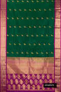 Green Dual Tone Kanchipuram Silk Saree with Zari Butta on the body and Zari Border.  displayed on a mannequin