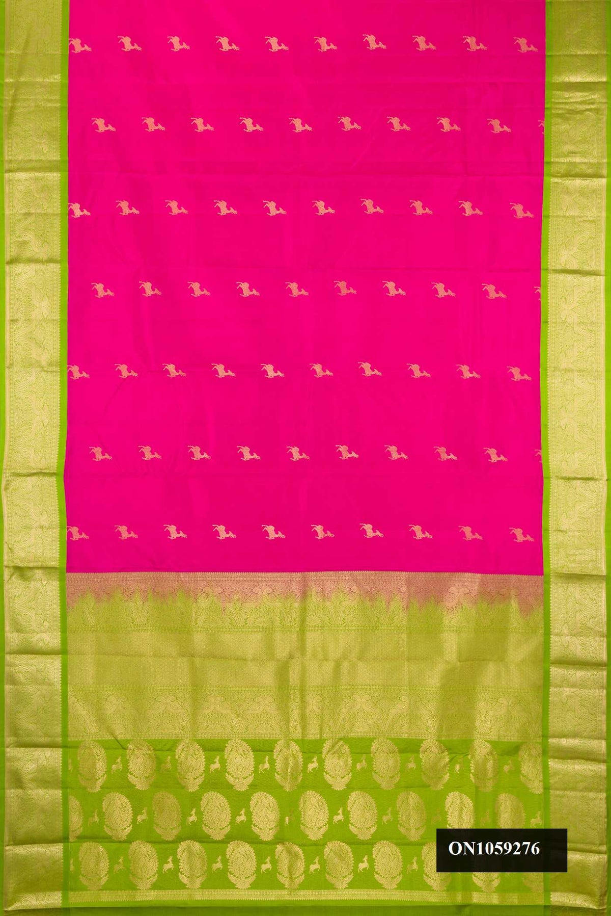 Dark Pink Dual Tone Kanchipuram Silk Saree with Zari Butta on the body and Zari Border.  displayed on a mannequin