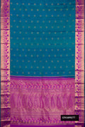 Peacock Blue Dual Tone Kanchipuram Silk Saree with Zari Butta on the body and Fancy Border.  displayed on a mannequin