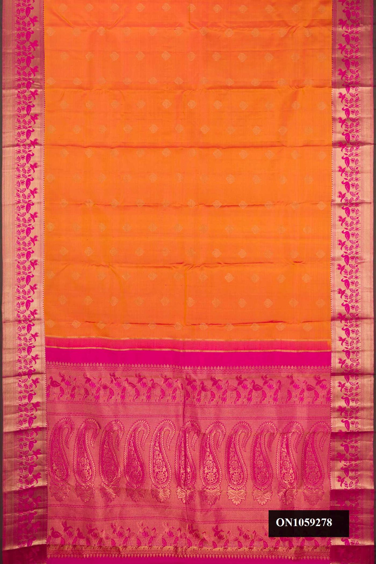 Mustard Dual Tone Kanchipuram Silk Saree with Zari Butta on the body and Fancy Border.  displayed on a mannequin