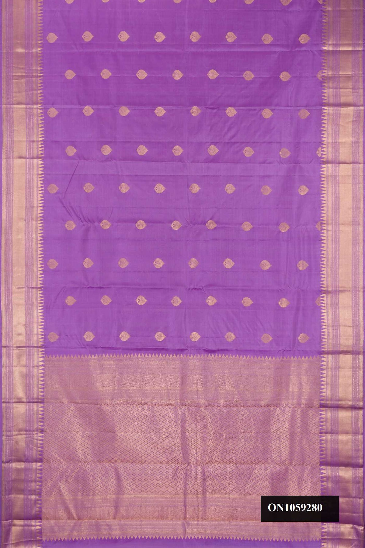 Lavender Dual Tone Kanchipuram Silk Saree with Zari Butta on the body and Fancy Border.  displayed on a mannequin