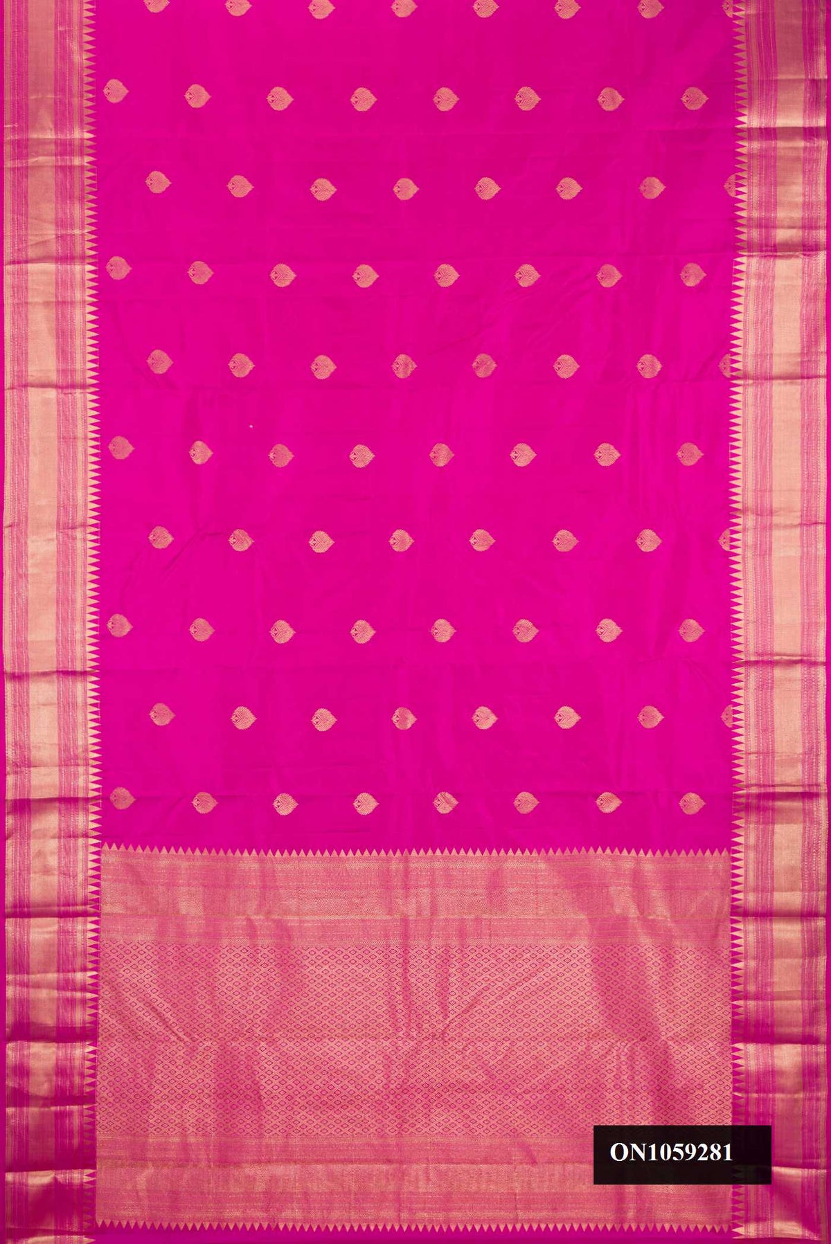 Dark Pink Dual Tone Kanchipuram Silk Saree with Zari Butta on the body and Fancy Border.  displayed on a mannequin