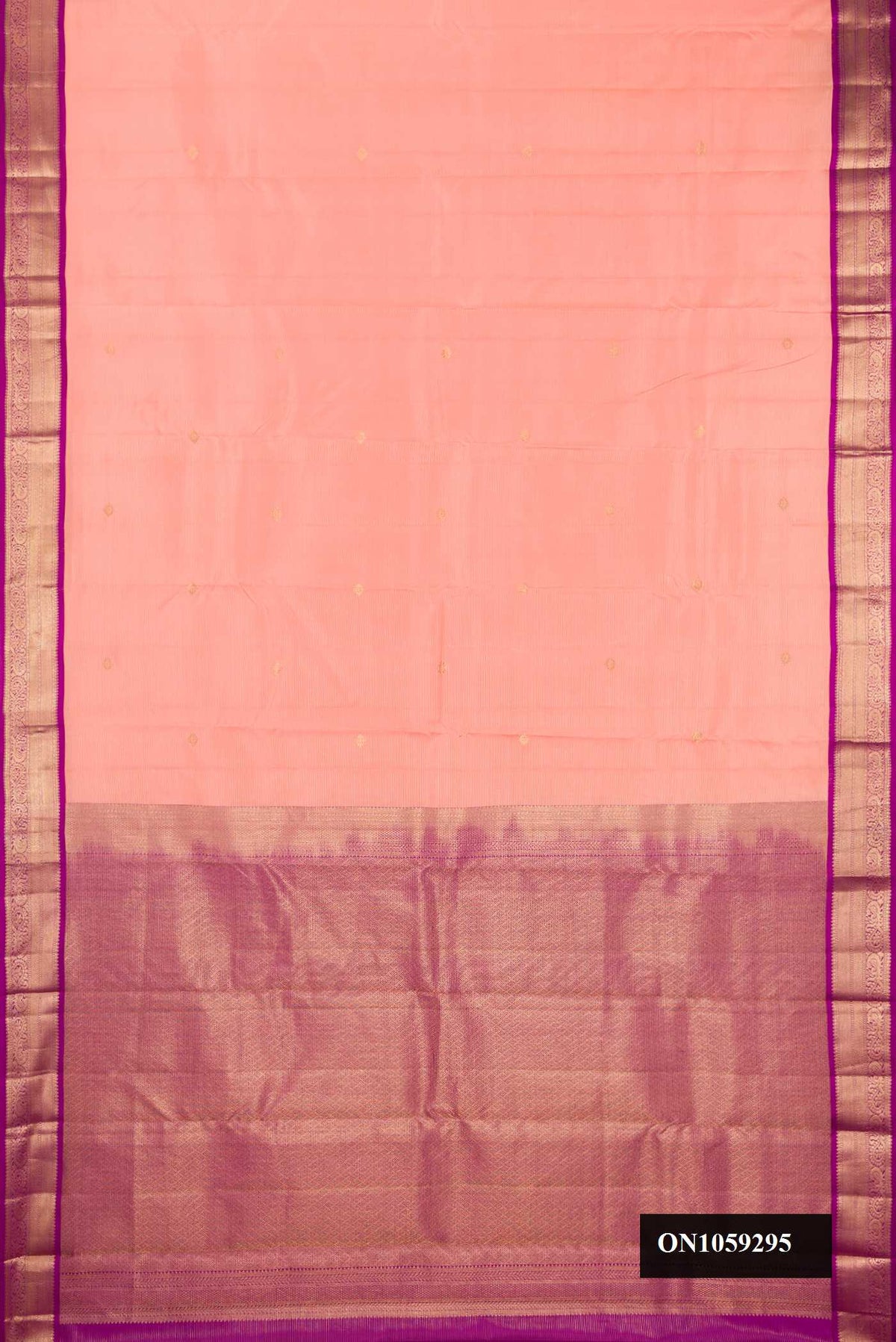 Peach Dual Tone Kanchipuram Silk Saree with Stripes on the body and Zari Border.  displayed on a mannequin