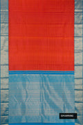 Brick Orange Dual Tone Kanchipuram Silk Saree with Stripes on the body and Zari Border.  displayed on a mannequin
