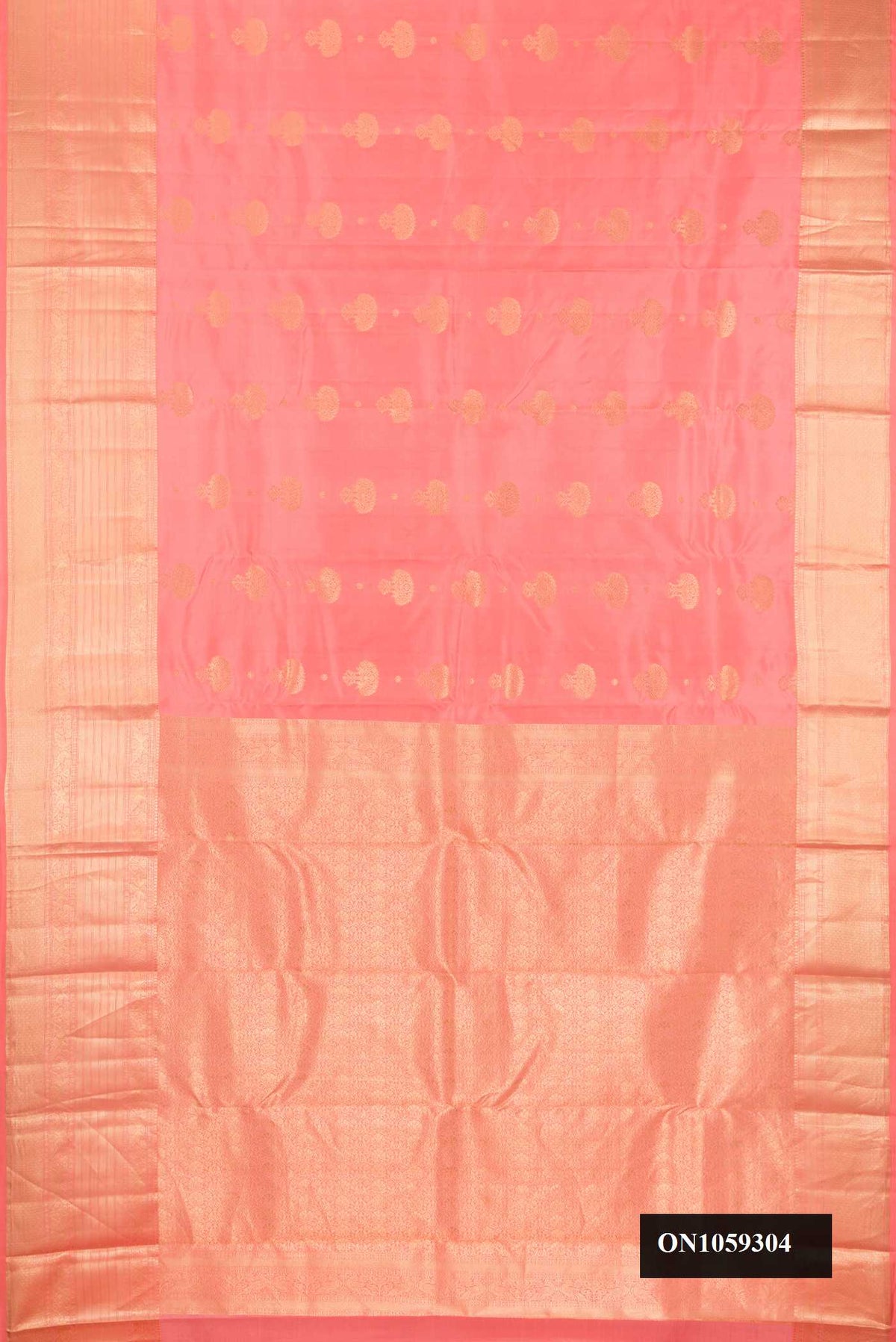 Peach Dual Tone Kanchipuram Silk Saree with Zari Butta on the body and Zari Border.  displayed on a mannequin