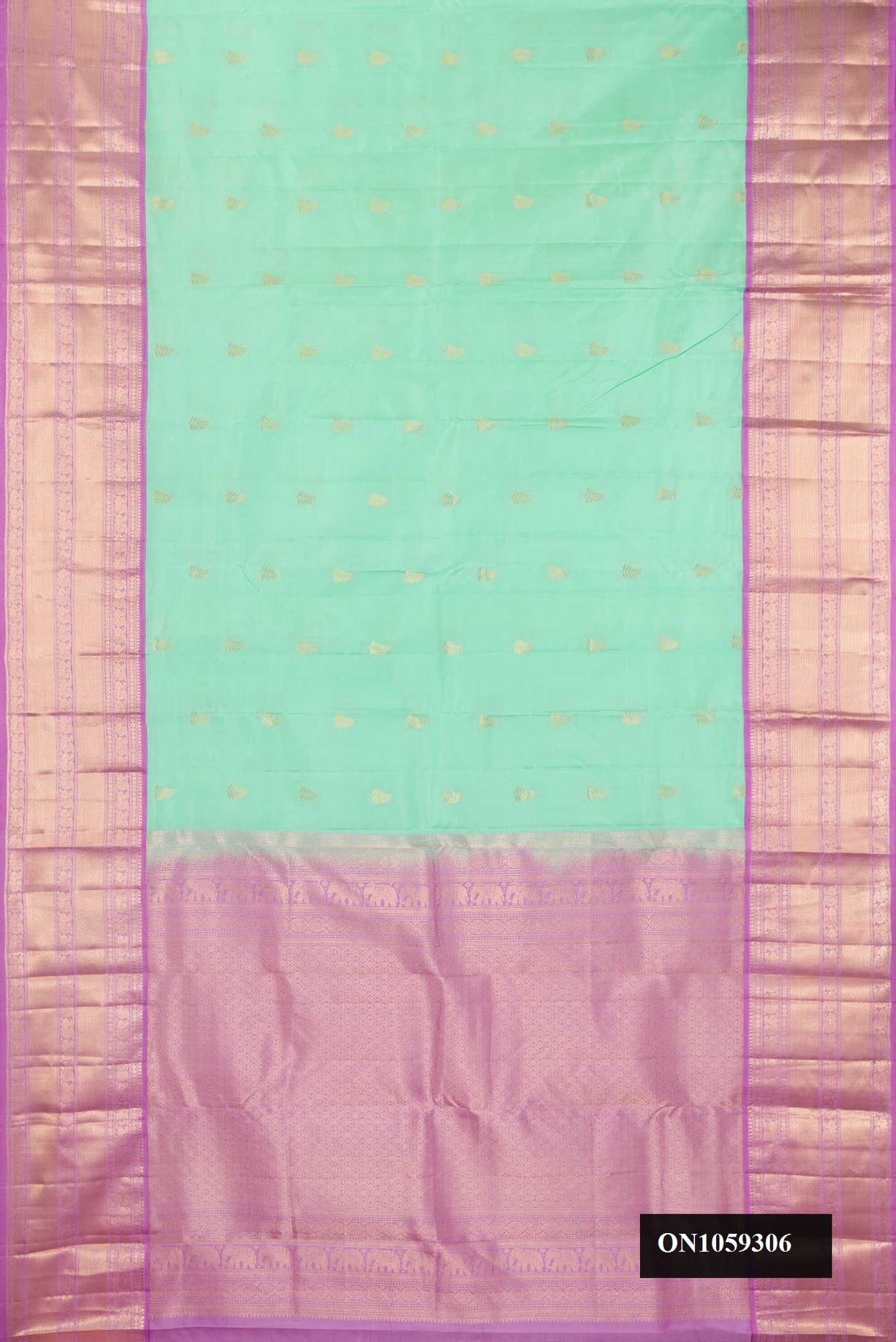 Sea Green Dual Tone Kanchipuram Silk Saree with Zari Butta on the body and Zari Border.  displayed on a mannequin