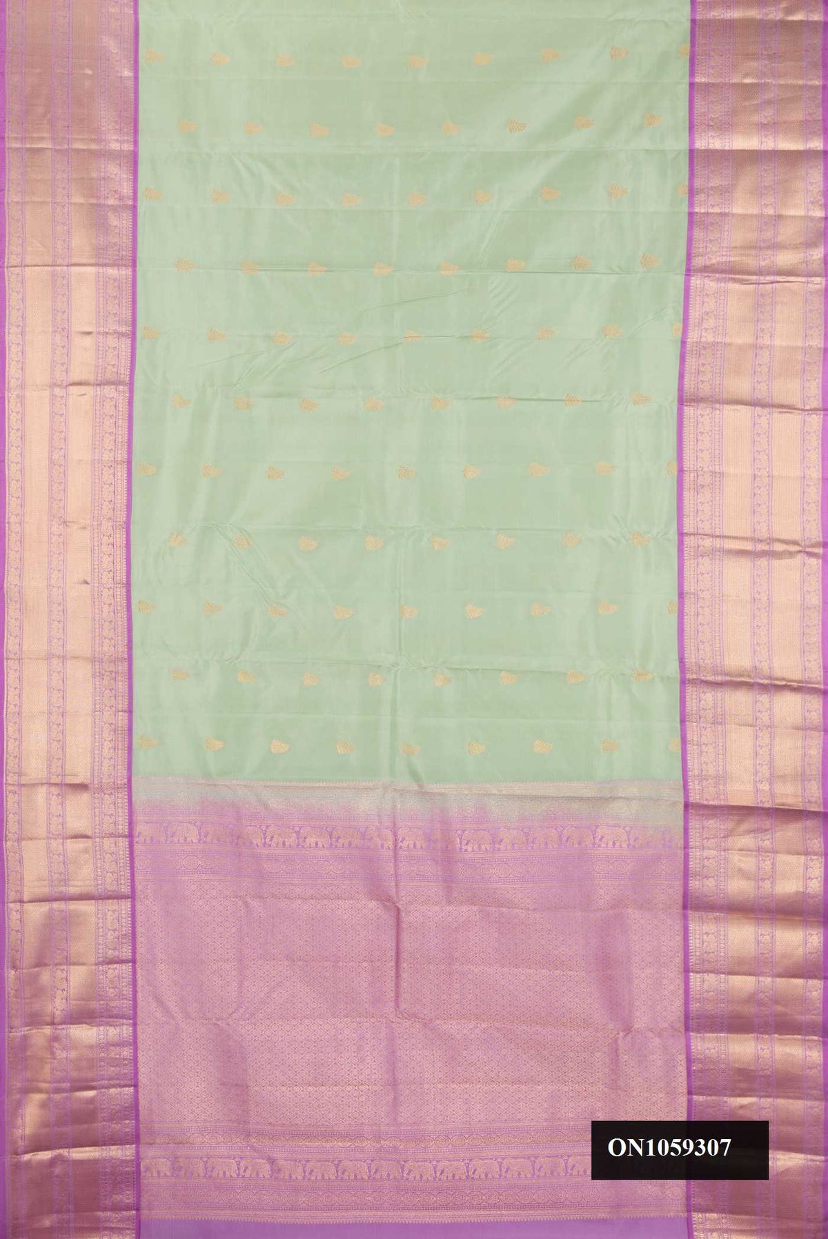 Pista Green Dual Tone Kanchipuram Silk Saree with Zari Butta on the body and Zari Border.  displayed on a mannequin