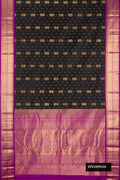 Black Dual Tone Kanchipuram Silk Saree with Zari Butta on the body and Zari Border.  displayed on a mannequin