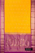 Yellow Dual Tone Kanchipuram Silk Saree with Zari Butta on the body and Zari Border.  displayed on a mannequin
