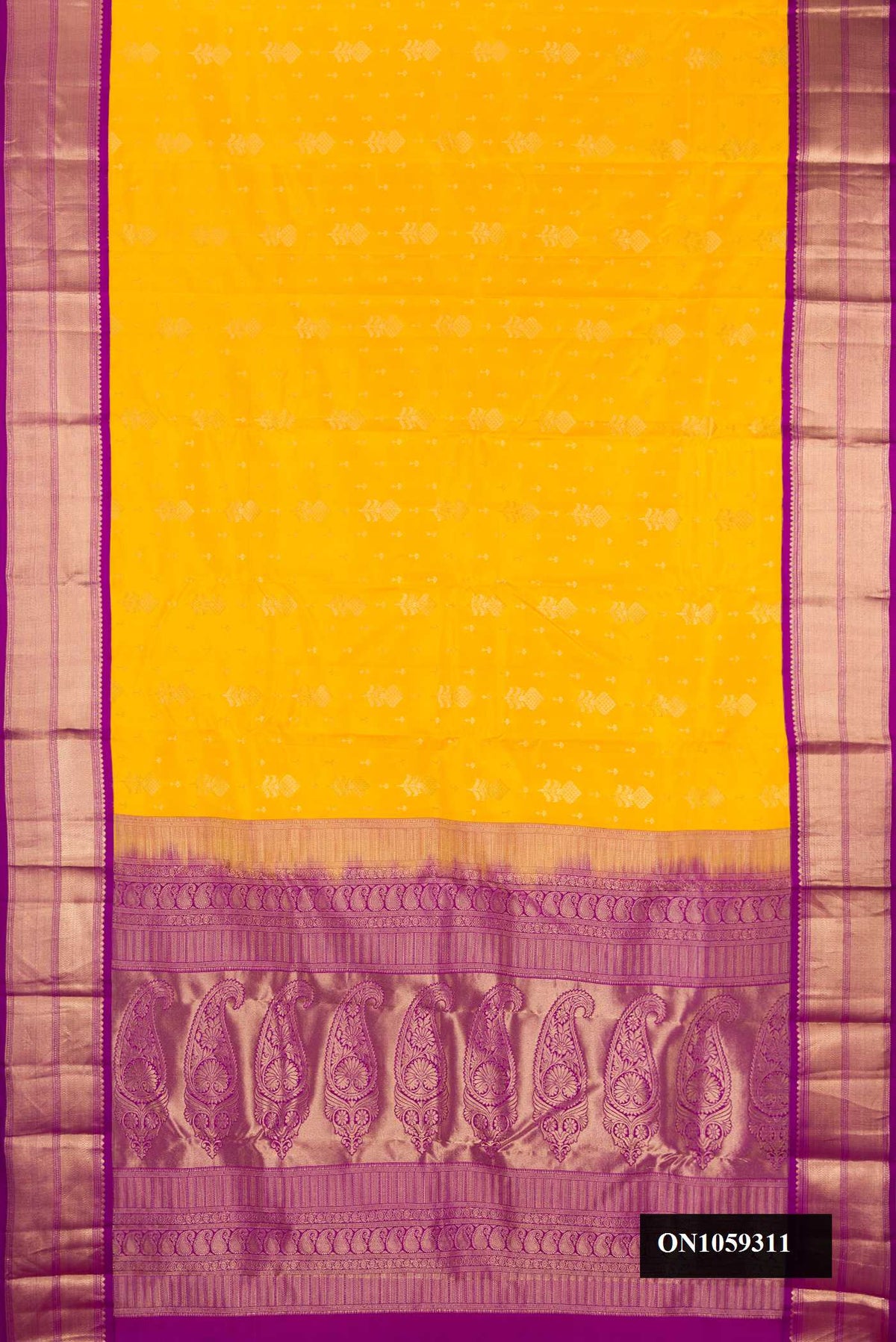 Yellow Dual Tone Kanchipuram Silk Saree with Zari Butta on the body and Zari Border.  displayed on a mannequin