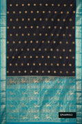 Black Dual Tone Kanchipuram Silk Saree with Zari Butta on the body and Zari Border.  displayed on a mannequin